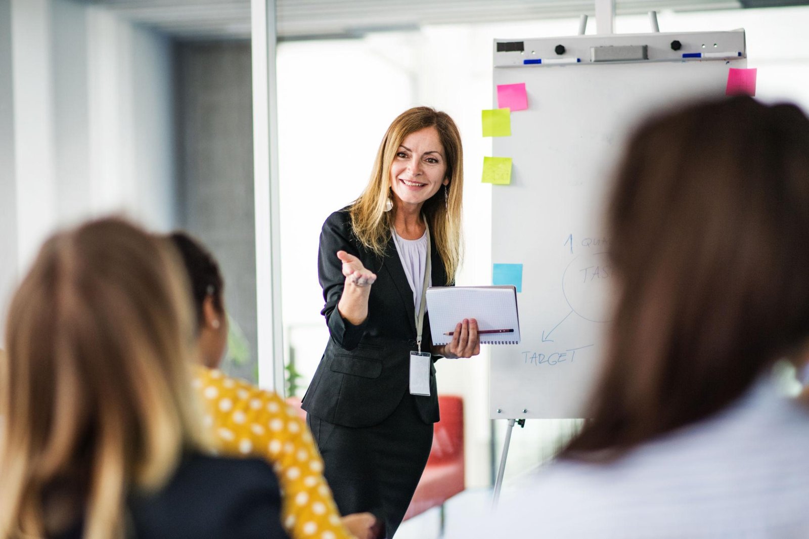 Professional workplace training facilitator presenting to a group